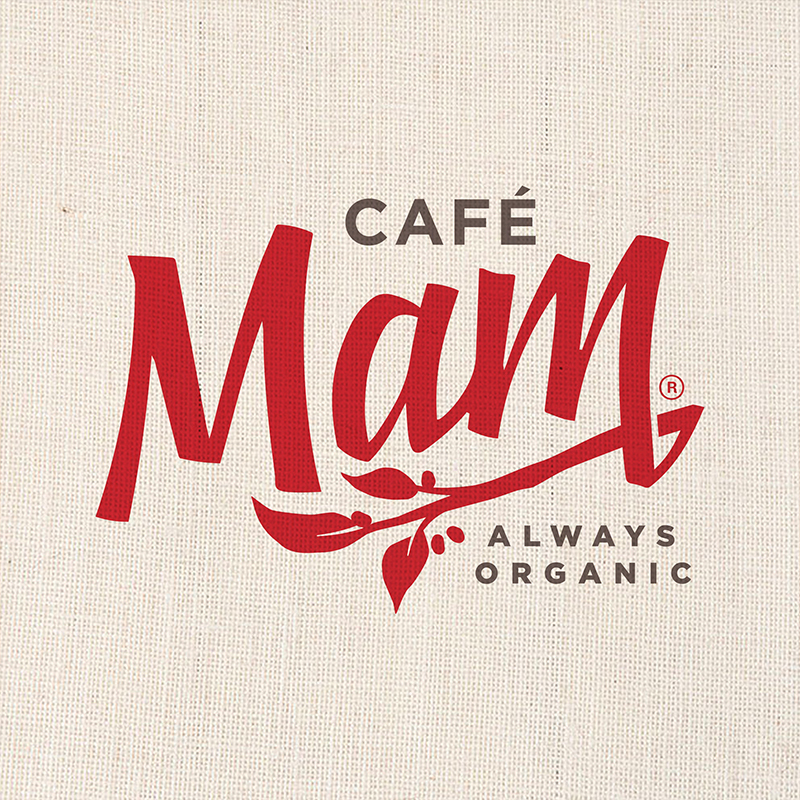 Cafe Mam Always Organic logo in red script with coffee branch on linen background