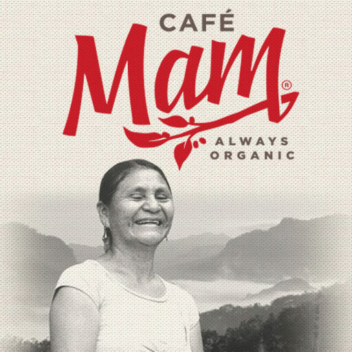 Cafe Mam Always Organic logo above a smiling woman in front of hazy mountains