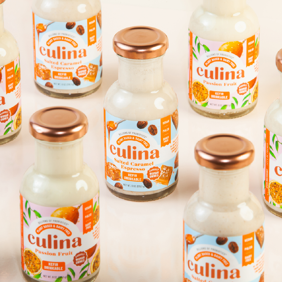 7 jars of Culina drinkable kefir with copper lids are photographed on a light tan background.