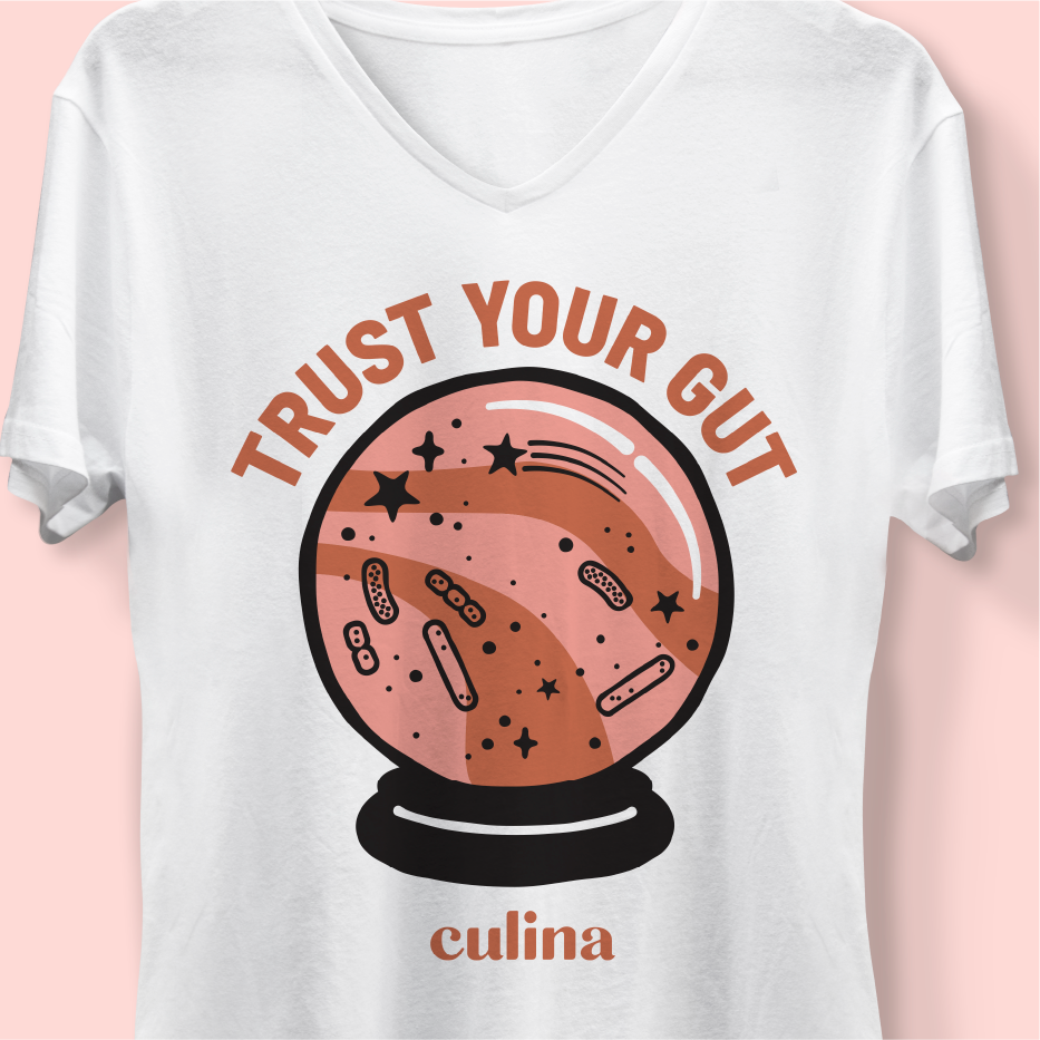 White V-neck t-shirt with 'Trust Your Gut' crystal ball graphic and Culina wordmark