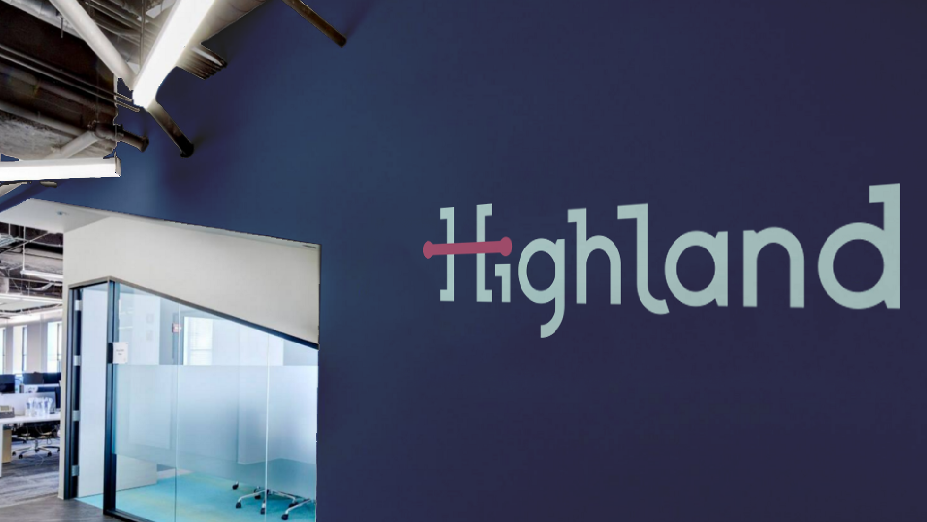Highland logo painted on a dark blue office wall beside a glass meeting room