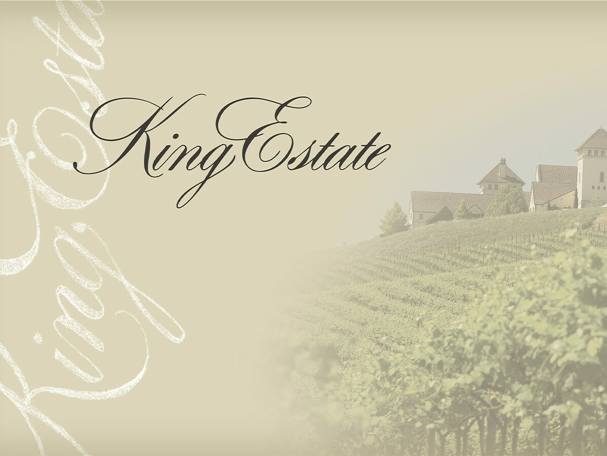 King Estate script wordmark over a faded vineyard hillside and winery buildings