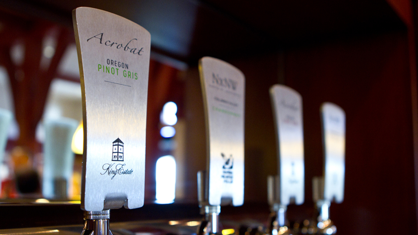 King Estate Acrobat Oregon Pinot Gris and NxNW wine tap handles at a bar