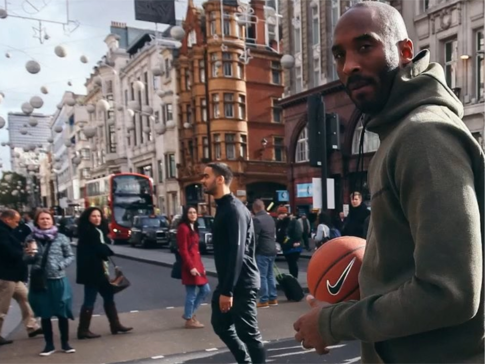 Nike London: Kobe Bryant carrying a basketball across a busy London street