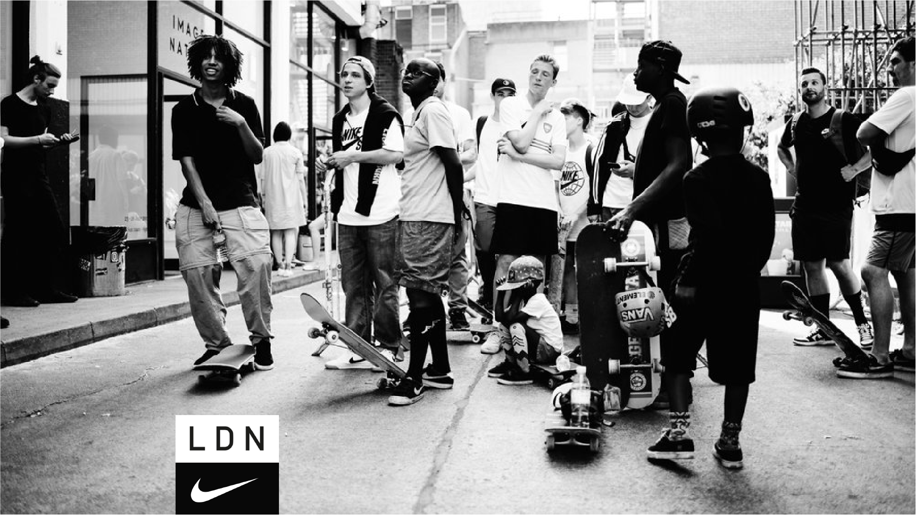 Nike London LDN skate event with skaters and boards gathered on a city street, black and white