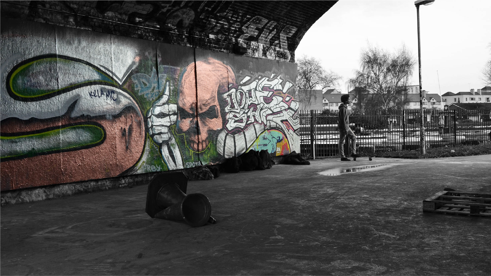 Nike London: skater beside a graffiti mural under a bridge at a skate park