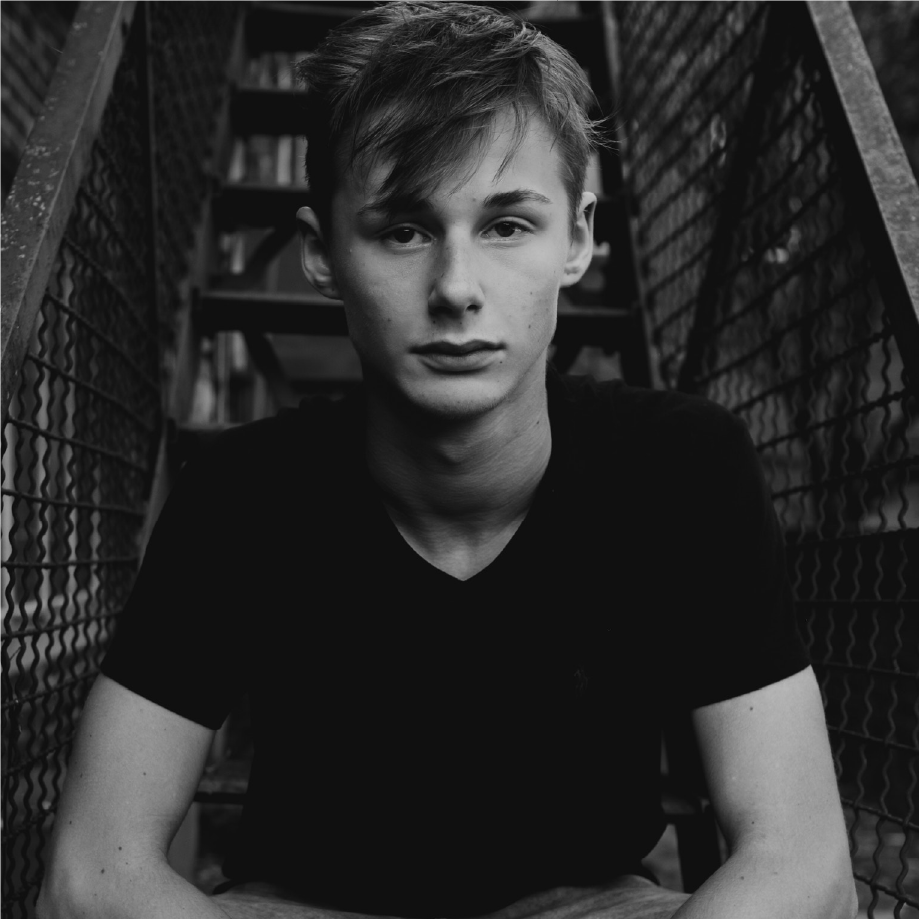 Nike London: young man in a black T-shirt seated on a fire escape, black and white portrait