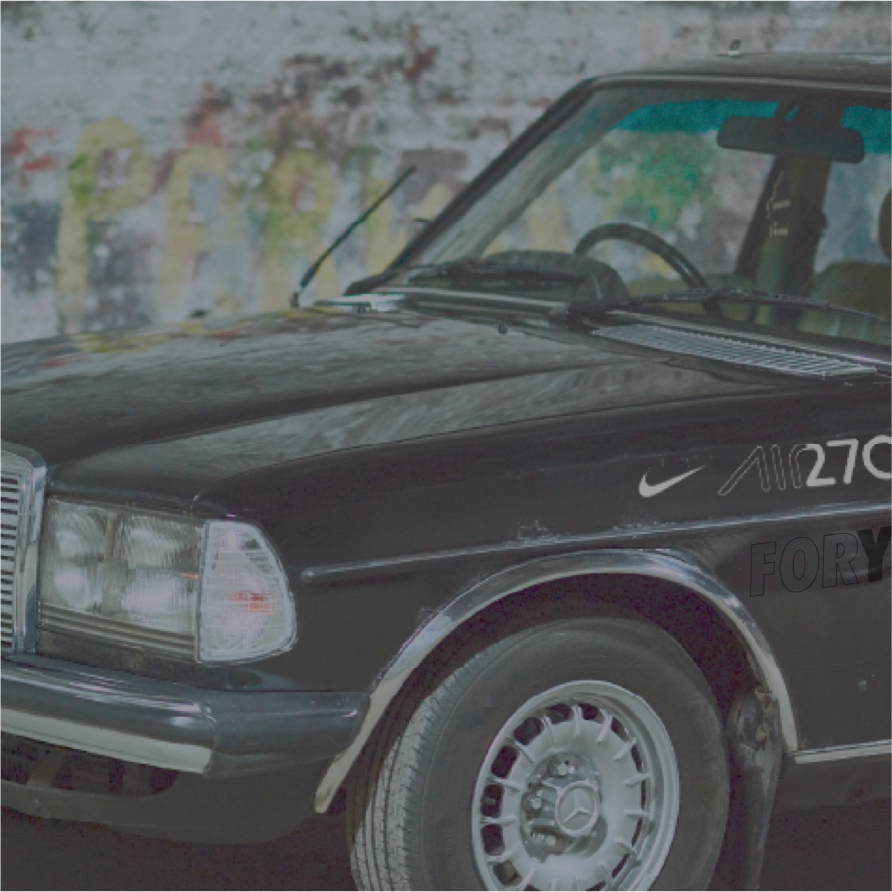 Nike London: front of a Mercedes car badged with Nike swoosh and Air 270 lettering by a graffiti wall