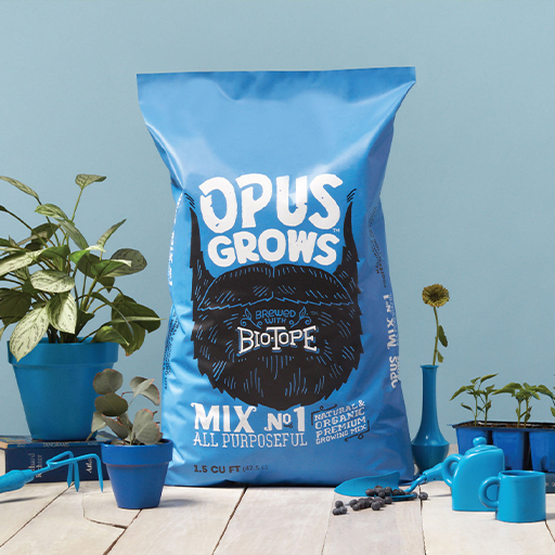 Blue Opus Grows Mix No.1 All Purposeful Biotope soil bag with garden tools and plants