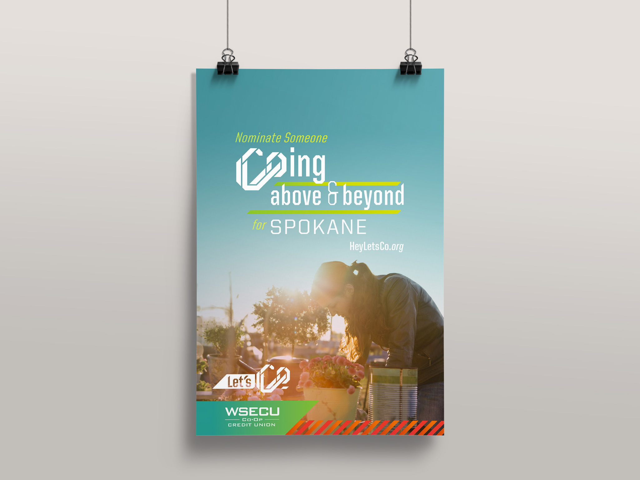 WSECU Let's Co poster, Nominate Someone C-oing above & beyond for Spokane, over a sunset welder