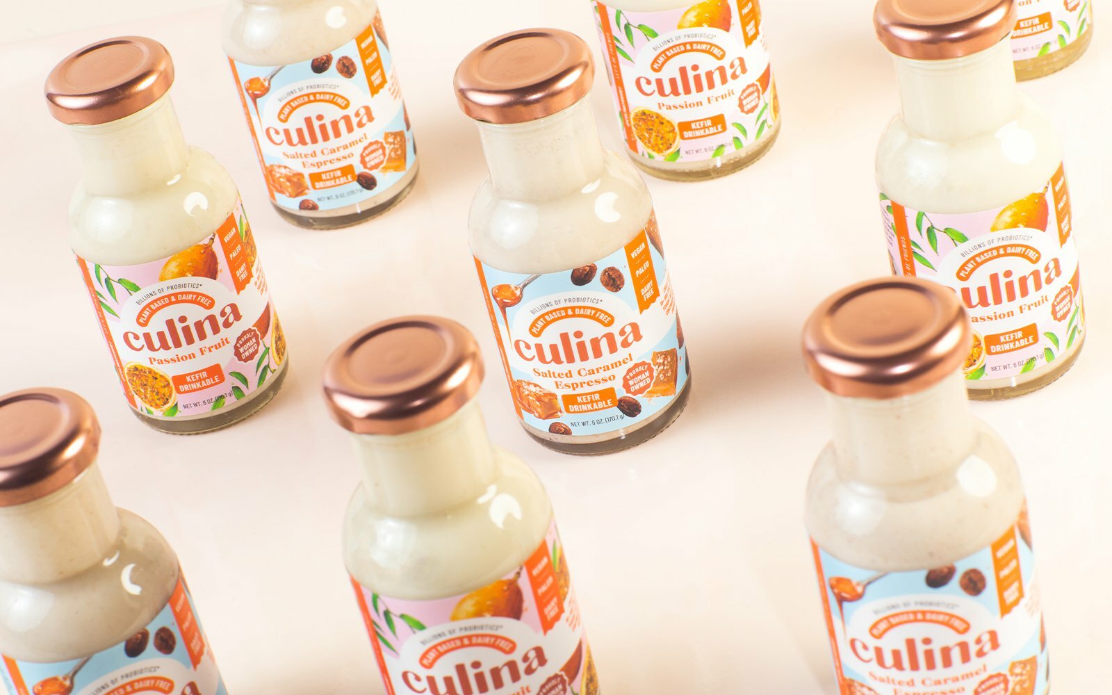 Bottles of Culina Salted Caramel Espresso and Passion Fruit drinks on a pale background