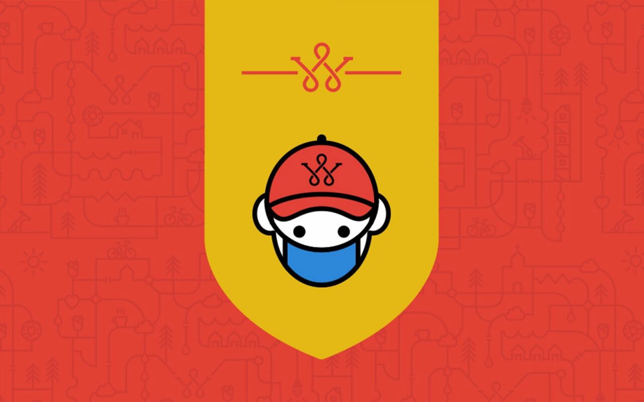 Illustration of a masked Wolcott worker in a red cap on a yellow banner over a red pattern