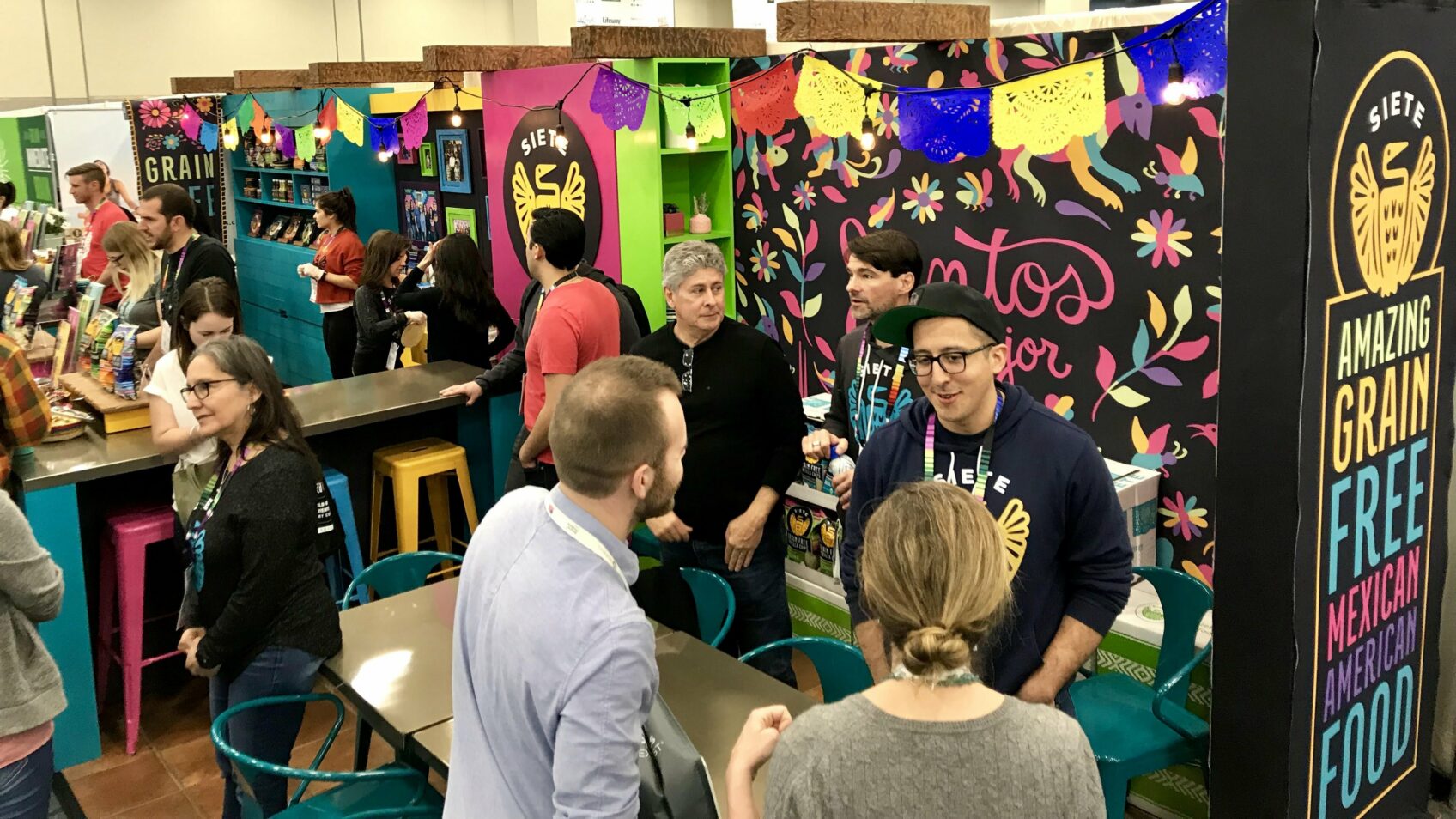 Crowd at Siete's Amazing Grain Free Mexican American Food trade-show booth