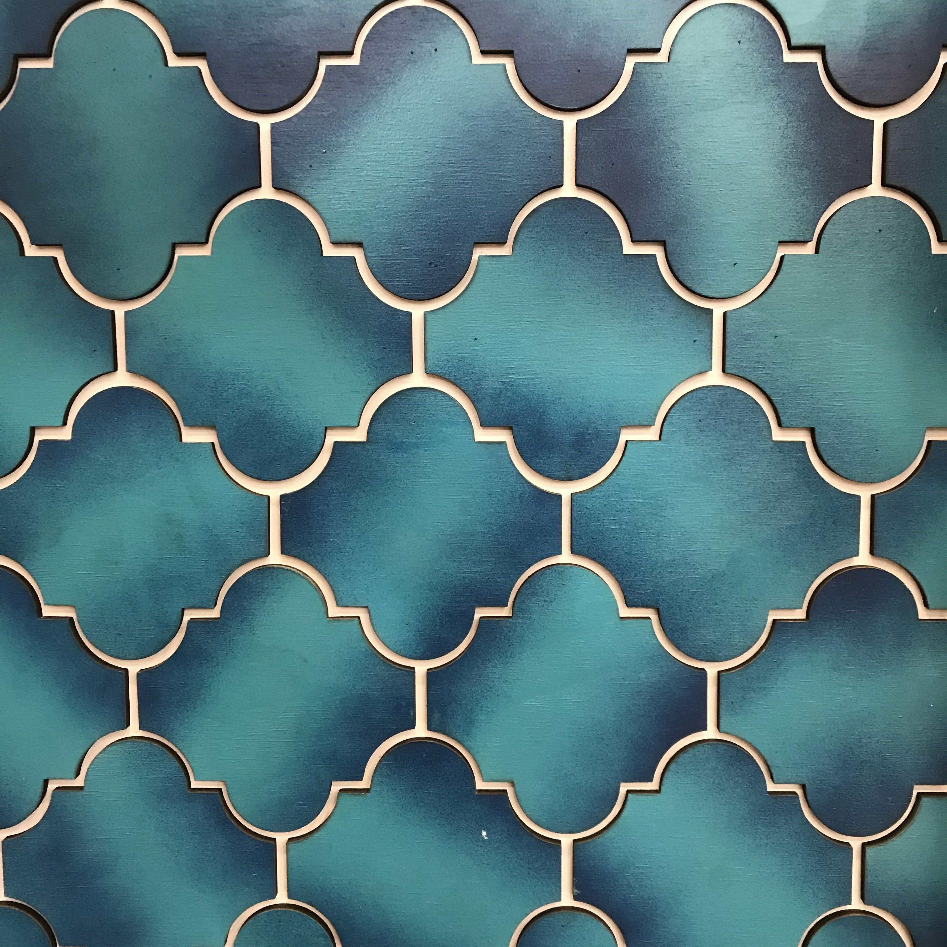 Teal Moroccan-style quatrefoil tile pattern from Siete's trade show booth