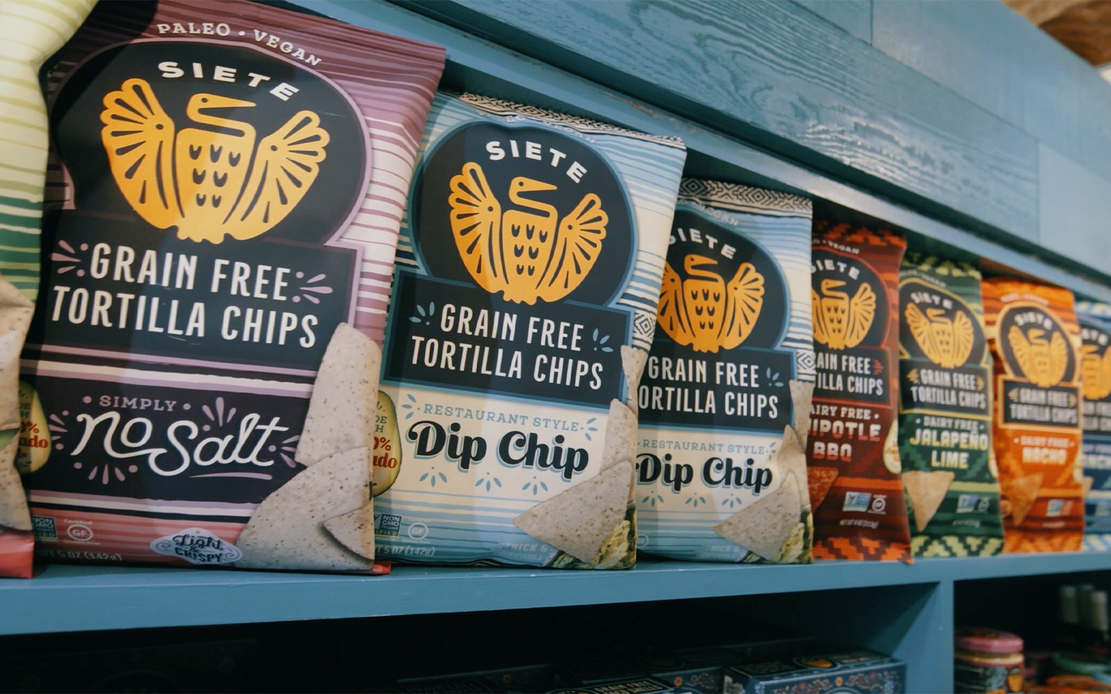 Siete grain free tortilla chip bags including No Salt and Dip Chip displayed on a store shelf