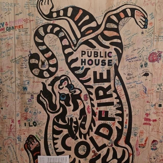 Signed Coldfire Public House wall mural of a stylized black-and-white tiger