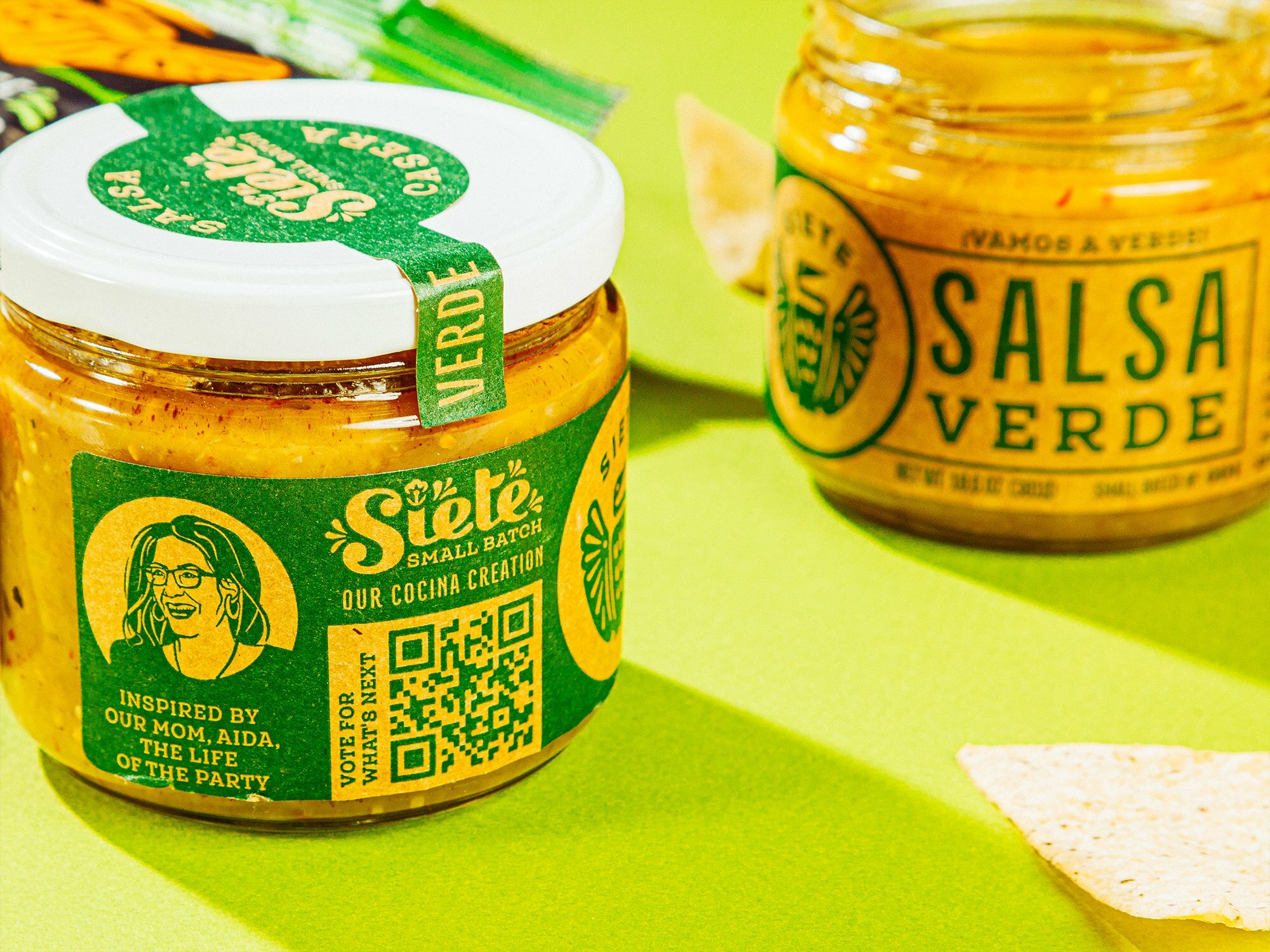 Siete Small Batch Salsa Verde jars with tortilla chips on a green background