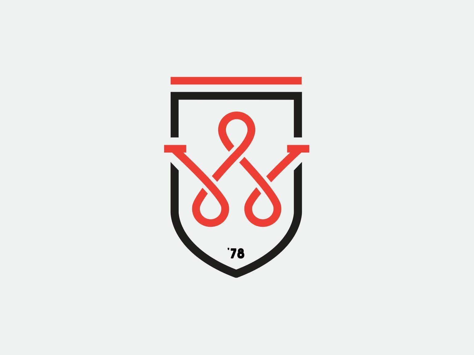 Wolcott shield logo with interlocking red and black W mark and the year '78